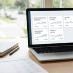 Financial KPIs for small business dashboard on a laptop in a Canadian office