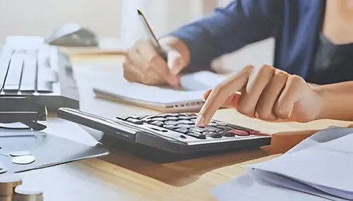 Bookkeeping and Payroll Services in Whistler BC, Squamish and Pemberton, Sea to Sky corridor and Vancouver 46 woman using calculator